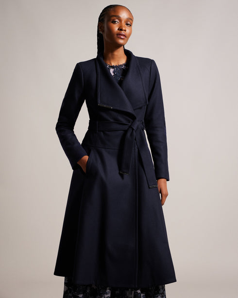 ROSEIKA-Outerwear-Wrap yourself in elegance with ROSEIKA. Our beloved wrap coat gets an upgrade with a full circle skirt and midi length. Featuring a magnetic collar closure and button fastening, this coat offers both style and functionality, so you can embrace chilly weather in style. Wrap coat with full circle skirt Midi length Wool blend Self tie belt Logo engraved hardware tips Magnetic collar closure Button fastening Long sleeves Pockets- Ted Baker Romania